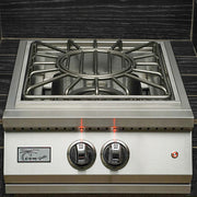 Stainless steel gas cooktop with two knobs on a tiled wall background