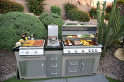 Outdoor kitchen with two grills, cooking equipment, and ingredients on a patio.