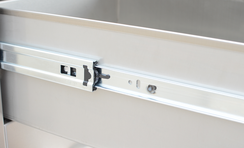 Close-up of a metal cabinet drawer slide mechanism.