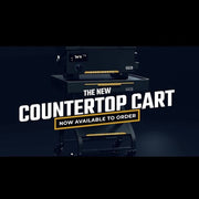 Cooking cart with drop-down utensil drawer open showing storage space