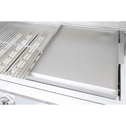 Stainless steel grill with a cover open on a green background