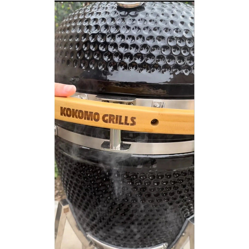 Close-up of a grill with 'Kokomo Grills' branding on a white background