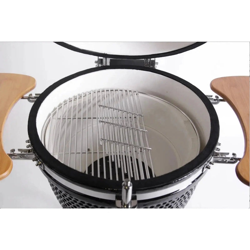Close-up of a ceramic kamado grill with wooden handles on a white background