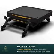 Pizza oven placed on top of outdoor countertop cooking cart on patio