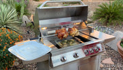 Stainless steel grill with food on a patio