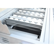 Egg carton in a refrigerator drawer with visible brand name.